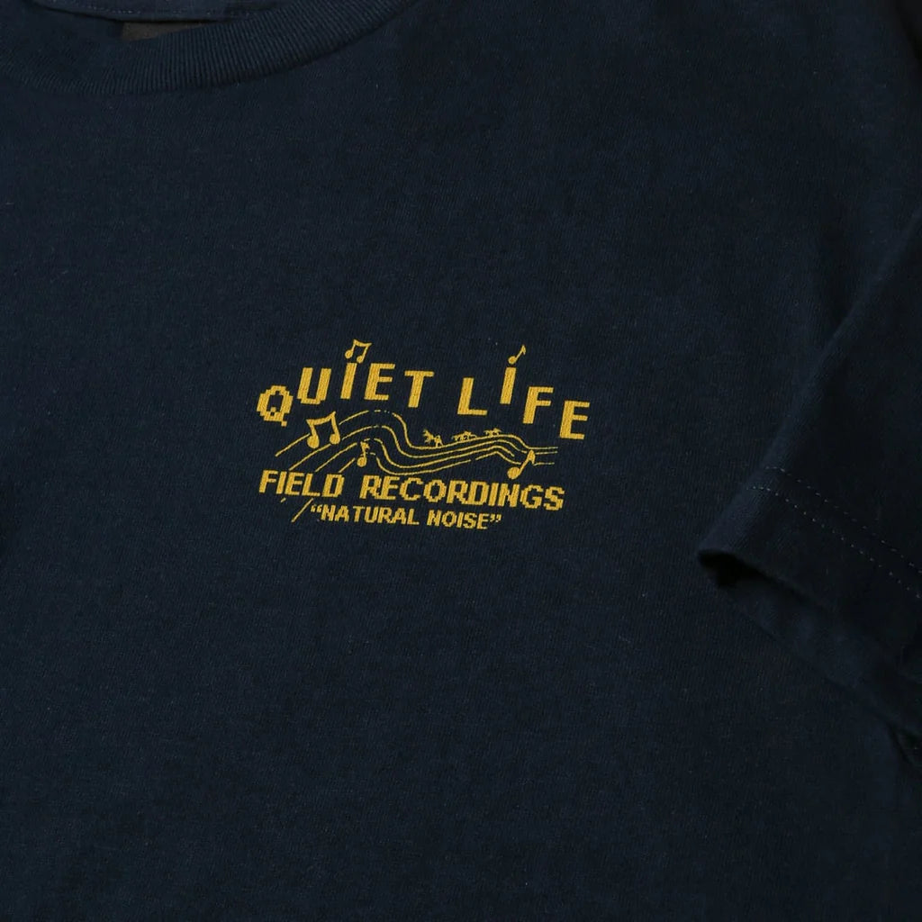 The Quiet Life t-shirt i blå med gult print og teksten Quiet Life field recordings